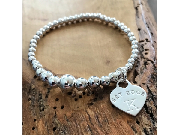 silver stretch bead bracelet with heart charm